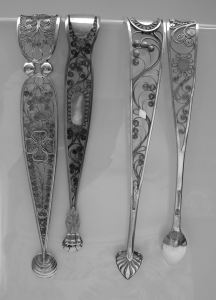 Two Austrian Filigree sugar tongs  and two German filigree tongs