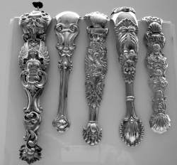 Over-sized sugar tongs with remarkably intricate designs