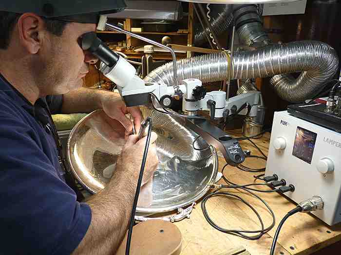 Jeffrey Herman filling in engraving with sterling, not silver solder