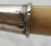 boar head mark on the handle of a silver rattle