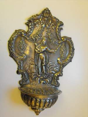 silver holy water font of unknown origin