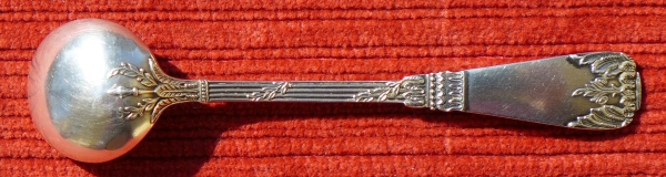 A silver-plated 10 cm long mustard spoon made from low-quality nickel silver in Empire style