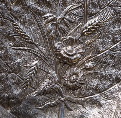 detail of a dustpan for table cleaning made from low-quality nickel silver c.1890