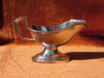 silver-plated gravy boat with a very characteristic 'Wellner' shape of the handle and the logo 'HAL' (Holland-America Line) dated by 1914