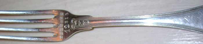 silver fork with seven French marks