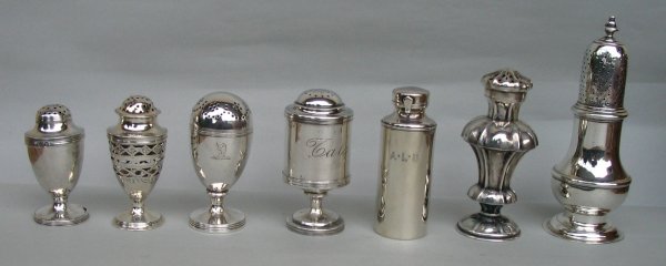 a small collection of silver shakers ranging from mid 18th to mid 20th century