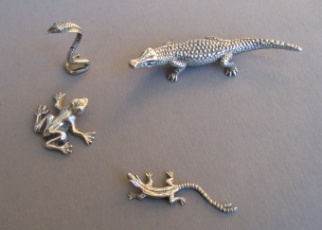 a collection of silver animals